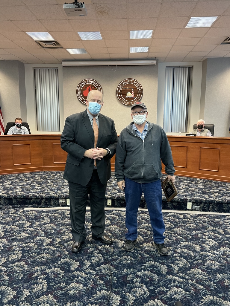Picture of Retiree Marvin Collins with Superintendent Dr. Greg Mullins