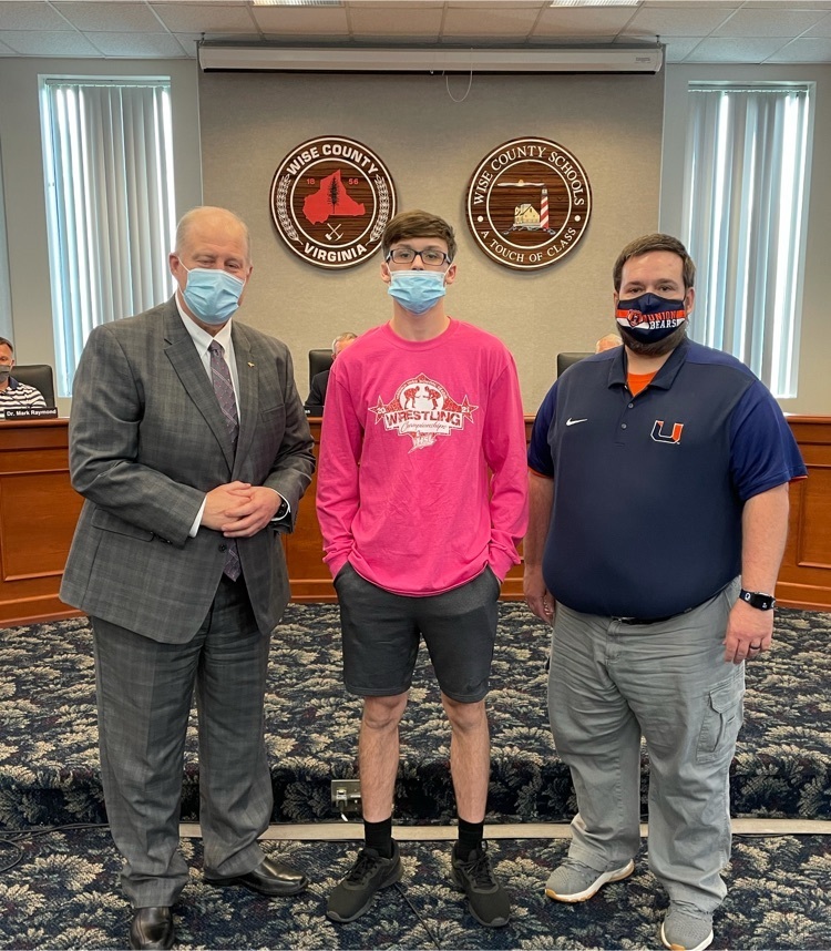 image of Thomas potter with the superintendent and wrestling coach
