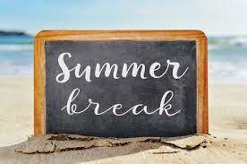 Picture of a chalkboard in the sand that says summer break